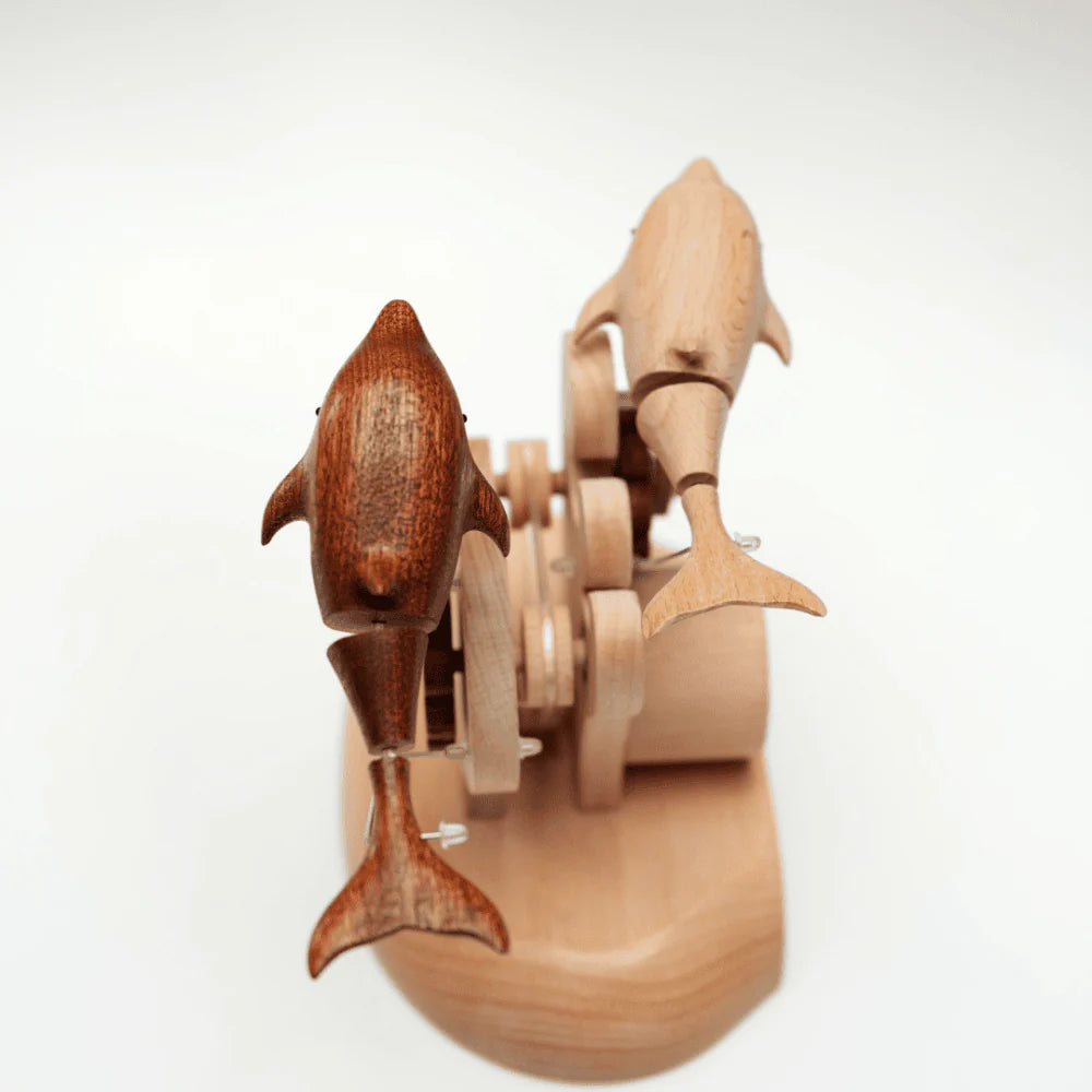 Wooden toy with two sharks on a white background